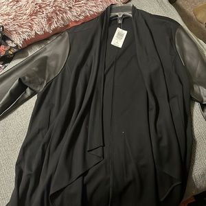 Brand new never worn black jacket with faux leather sleeves